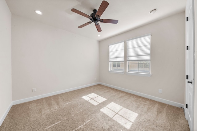 empty room featuring carpet flooring, baseboards, a ceiling fan, and recessed lighting