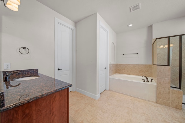 bathroom with a garden tub, vanity, tile patterned flooring, visible vents, and a stall shower