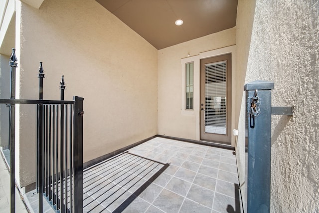 doorway to property featuring stucco siding