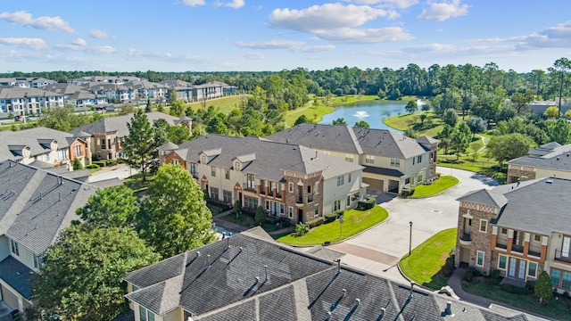 bird's eye view featuring a residential view and a water view