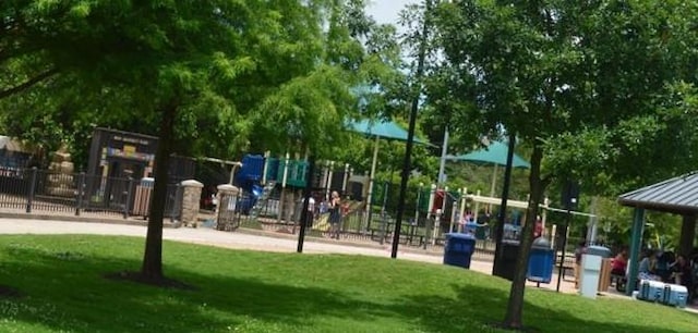 5600 Community Dr, Houston, TX 77005 - surrounding community featuring a yard, fence, and playground community