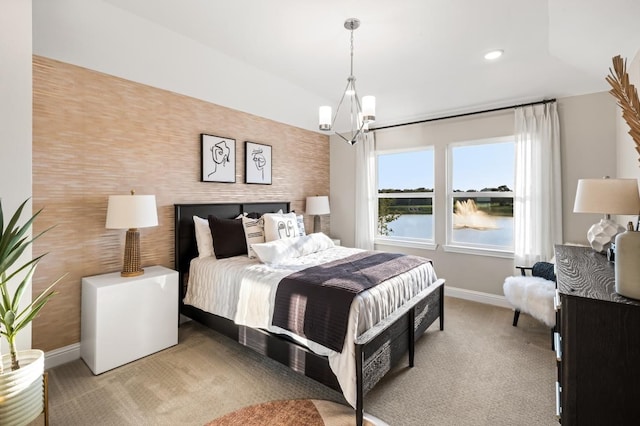 bedroom with baseboards, a notable chandelier, a water view, recessed lighting, and light carpet