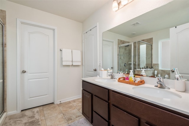 full bathroom featuring visible vents, a sink, and a stall shower