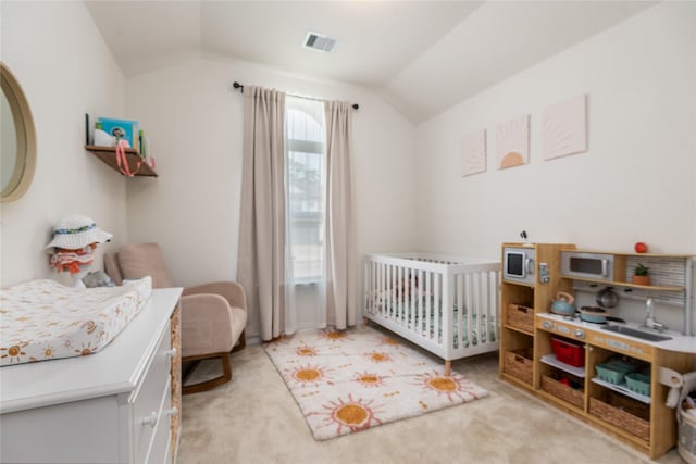 4335 Leyland Brook Ln, Houston, TX 77068 - bedroom with lofted ceiling, a crib, and light carpet