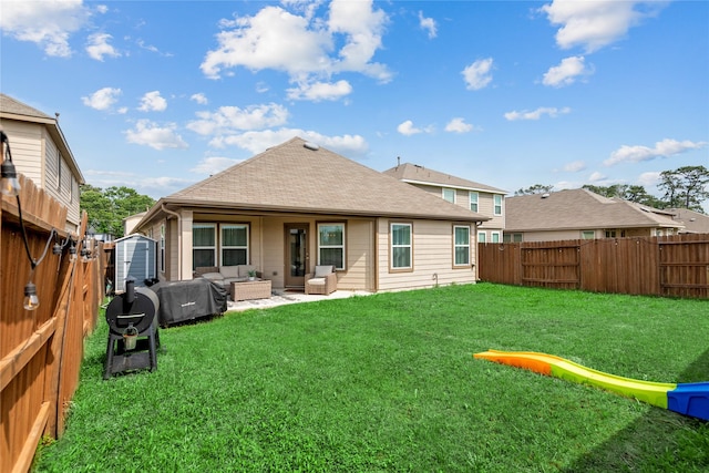 4335 Leyland Brook Ln, Houston, TX 77068 - back of house with a storage shed, an outdoor living space, a shingled roof, a patio, and an outbuilding