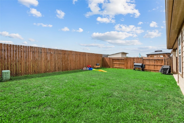 view of yard with a fenced backyard