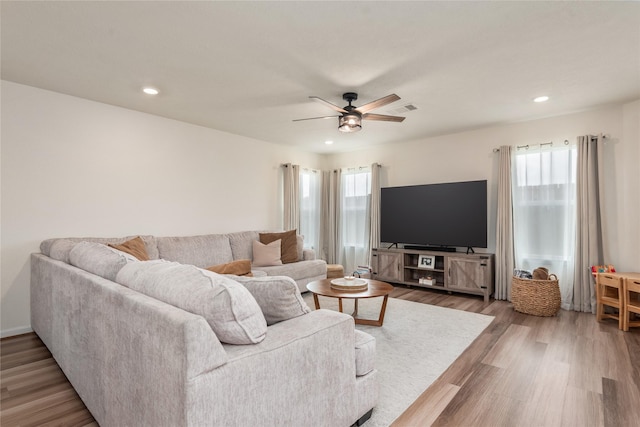 living room with recessed lighting, ceiling fan, and wood finished floors