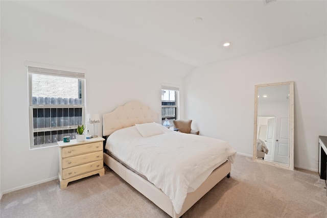 bedroom with baseboards, recessed lighting, and light carpet