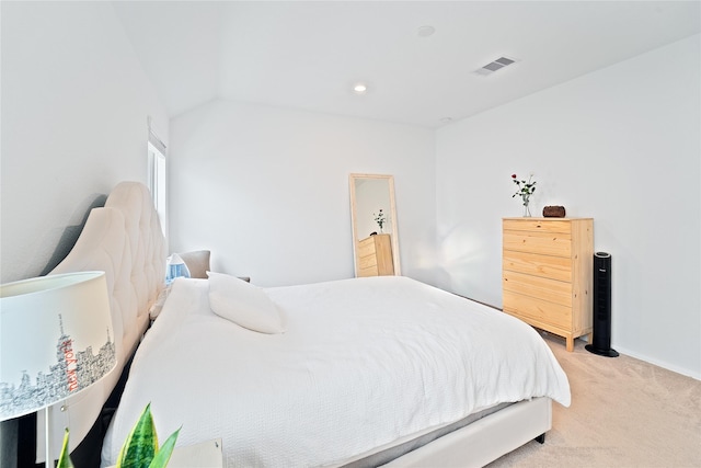 bedroom with visible vents, light colored carpet, and baseboards