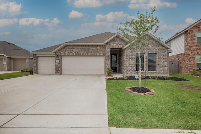4411 Aspen Colony Ln, Baytown, TX 77521 - single story home featuring an attached garage, brick siding, driveway, and a front yard
