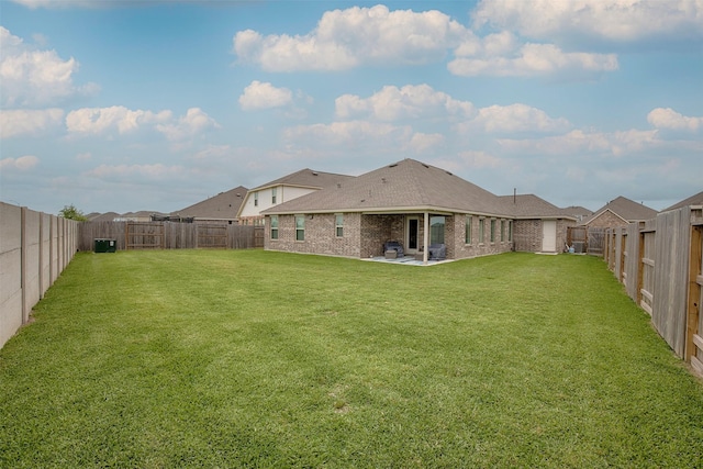 4411 Aspen Colony Ln, Baytown, TX 77521 - view of yard featuring a fenced backyard, central AC, and a patio
