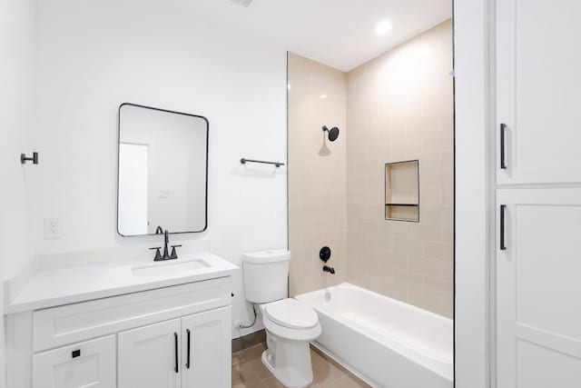 bathroom with vanity, washtub / shower combination, and toilet