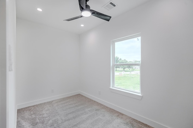 carpeted empty room with ceiling fan, baseboards, visible vents, and recessed lighting