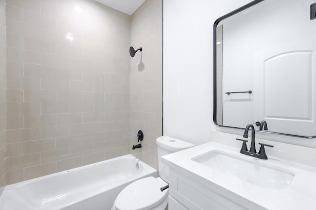 bathroom with toilet, vanity, and bathtub / shower combination