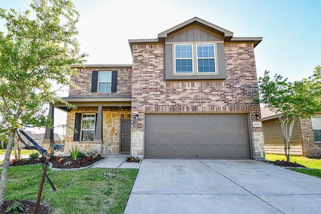 traditional-style house featuring brick siding, driveway, stone siding, and an attached garage