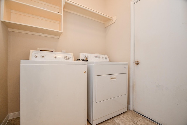 laundry area featuring separate washer and dryer and laundry area