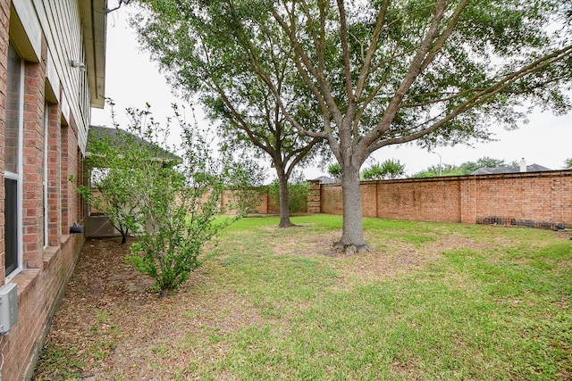view of yard with a fenced backyard
