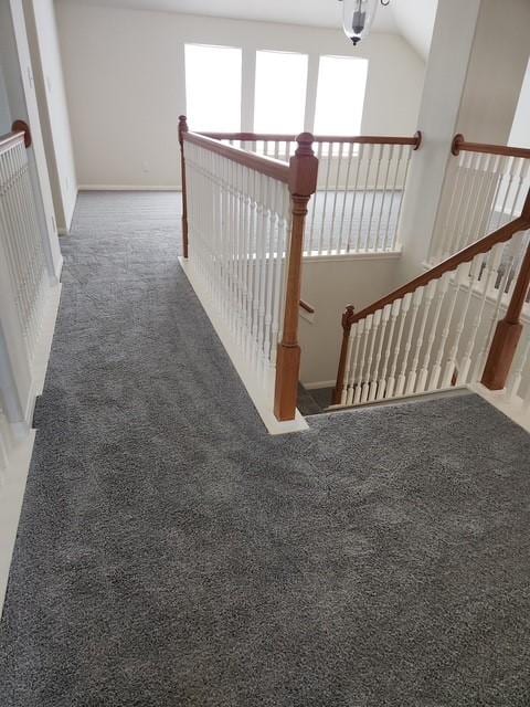 7503 Boxwood Ridge Ln, Richmond, TX 77407 - corridor with carpet flooring, baseboards, an upstairs landing, and vaulted ceiling