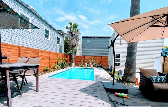 1964 Norfolk St, Houston, TX 77098 - view of swimming pool featuring a deck, a fenced backyard, and outdoor dining space