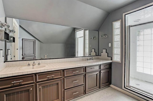 1964 Norfolk St, Houston, TX 77098 - full bathroom with lofted ceiling, double vanity, and a stall shower