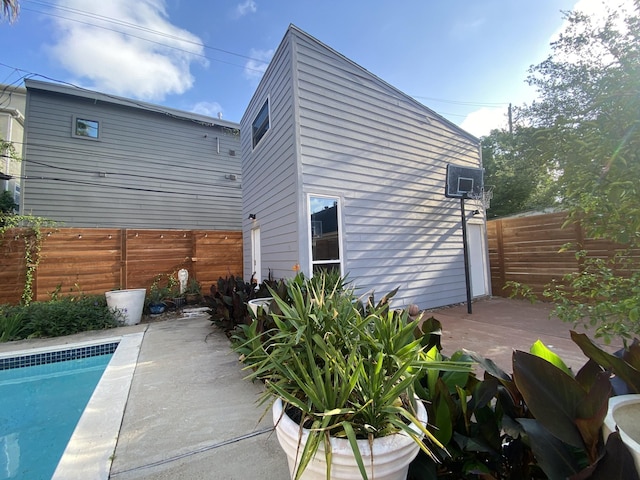 1964 Norfolk St, Houston, TX 77098 - rear view of house with a fenced backyard, a deck, and a patio area