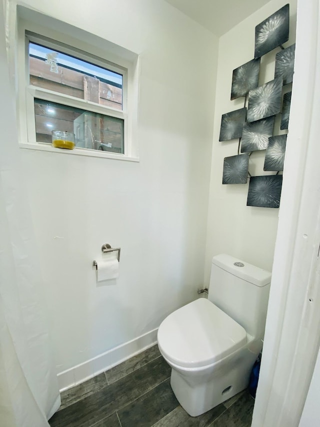 1964 Norfolk St, Houston, TX 77098 - bathroom with wood finished floors, toilet, and baseboards
