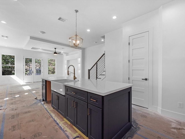 1130 Miller Rd, Sealy, TX 77474 - kitchen featuring visible vents, baseboards, a sink, open floor plan, and french doors