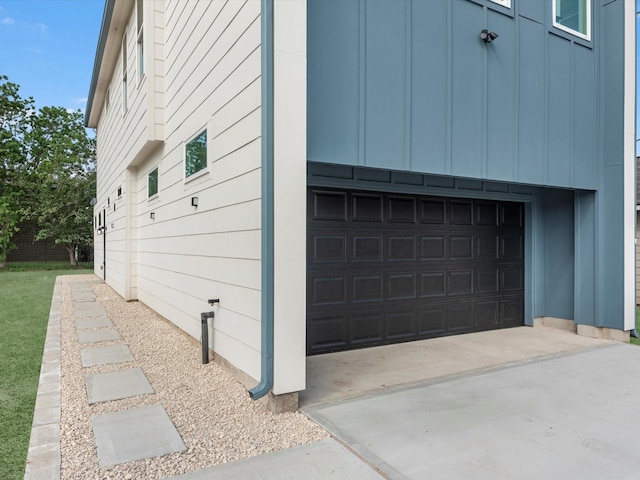 1130 Miller Rd, Sealy, TX 77474 - view of property exterior featuring board and batten siding, driveway, and a garage