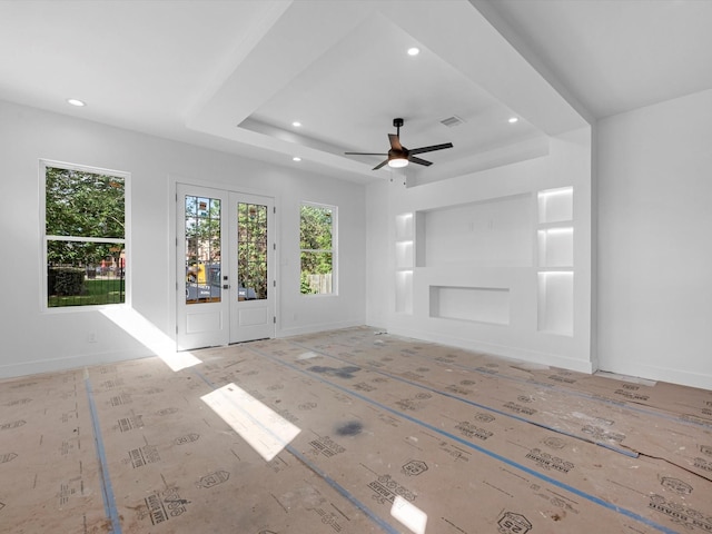 1130 Miller Rd, Sealy, TX 77474 - unfurnished living room with baseboards, recessed lighting, visible vents, a tray ceiling, and ceiling fan