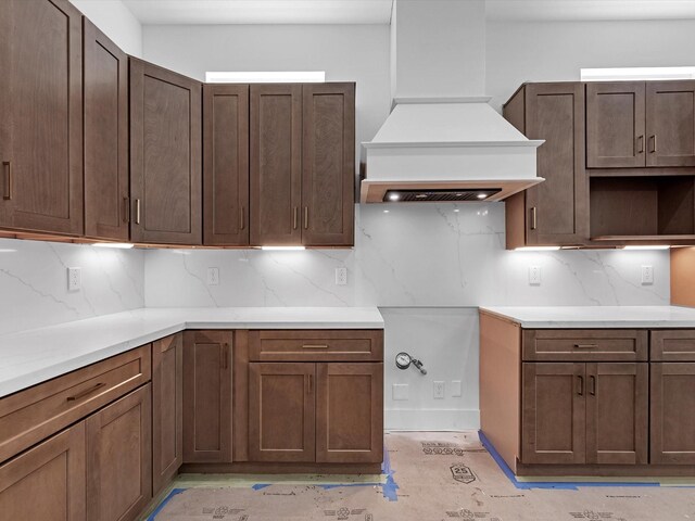 1130 Miller Rd, Sealy, TX 77474 - kitchen featuring tasteful backsplash, premium range hood, and light countertops