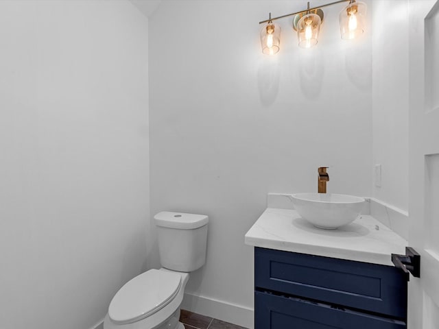 1130 Miller Rd, Sealy, TX 77474 - half bathroom with toilet, tile patterned floors, vanity, and baseboards