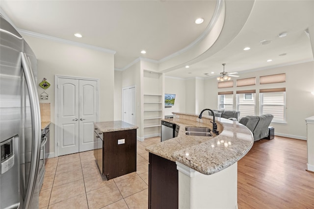 5329 Kansas St, Houston, TX 77007 - kitchen with ornamental molding, recessed lighting, a large island, a sink, and stainless steel appliances