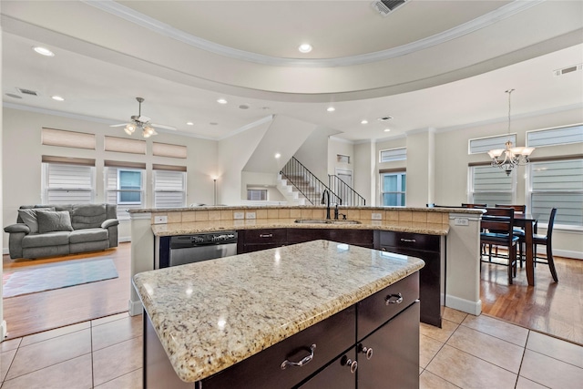 5329 Kansas St, Houston, TX 77007 - kitchen with a large island, open floor plan, light tile patterned floors, visible vents, and a sink