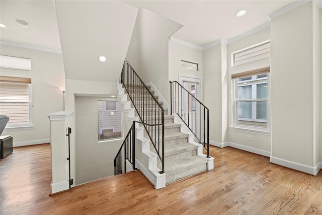 5329 Kansas St, Houston, TX 77007 - stairs with crown molding, wood finished floors, and baseboards
