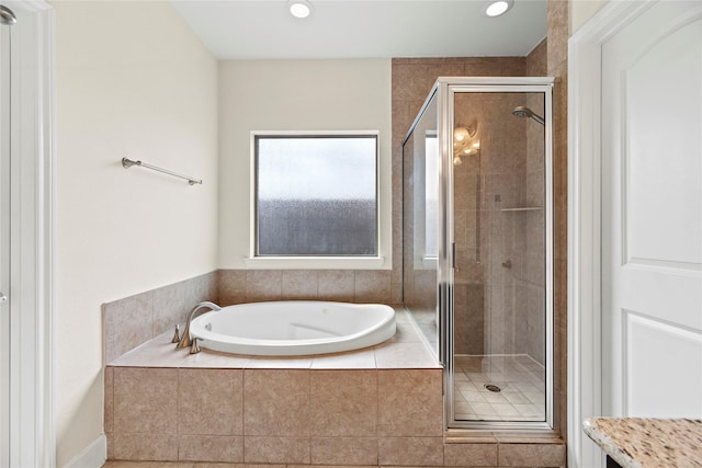 5329 Kansas St, Houston, TX 77007 - full bath featuring a shower stall, recessed lighting, and a garden tub