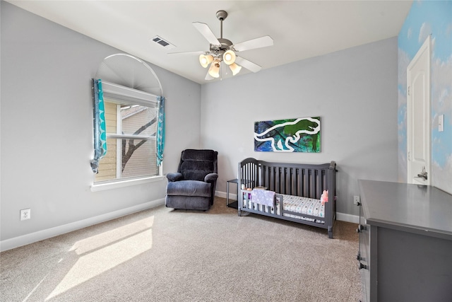 5329 Kansas St, Houston, TX 77007 - bedroom featuring a nursery area, baseboards, visible vents, and carpet floors