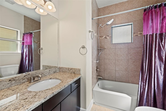 5329 Kansas St, Houston, TX 77007 - bathroom with vanity, tile patterned flooring, toilet, visible vents, and shower / bath combo with shower curtain