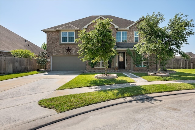 view of front of property with driveway, a front lawn, an attached garage, brick siding, and fence
