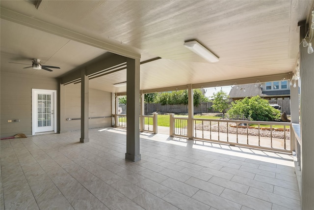 view of patio featuring fence and a ceiling fan