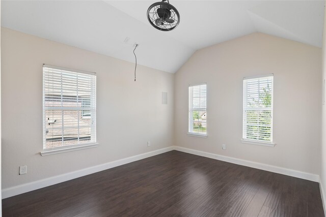13315 Edison Trace Ln, Tomball, TX 77377 - spare room with baseboards, lofted ceiling, and dark wood-type flooring