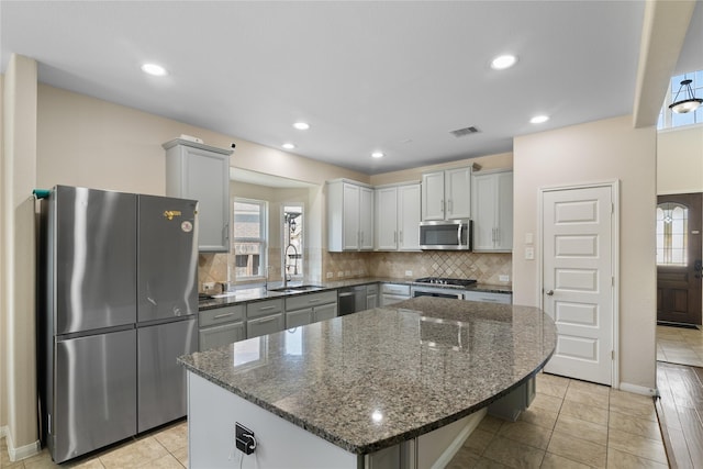 13315 Edison Trace Ln, Tomball, TX 77377 - kitchen with plenty of natural light, appliances with stainless steel finishes, and visible vents