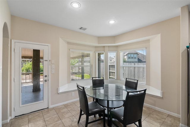 13315 Edison Trace Ln, Tomball, TX 77377 - dining space featuring light tile patterned flooring, baseboards, and visible vents