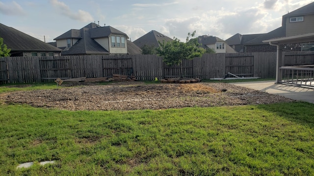 13315 Edison Trace Ln, Tomball, TX 77377 - view of yard featuring a patio area, a residential view, and a fenced backyard