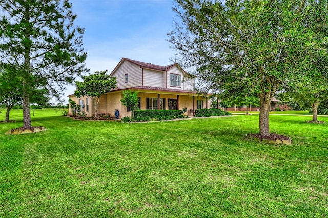 3026 Dees Cir, Sealy, TX 77474 - view of front of home featuring a front lawn and stucco siding
