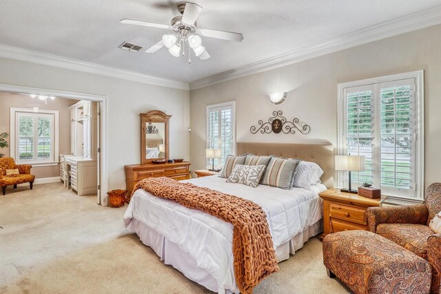 3026 Dees Cir, Sealy, TX 77474 - bedroom with ceiling fan, ornamental molding, visible vents, and light colored carpet