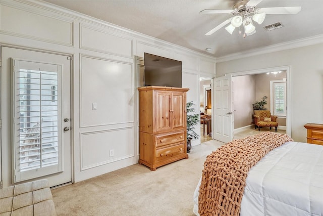 3026 Dees Cir, Sealy, TX 77474 - bedroom with crown molding, visible vents, a decorative wall, ceiling fan, and light carpet