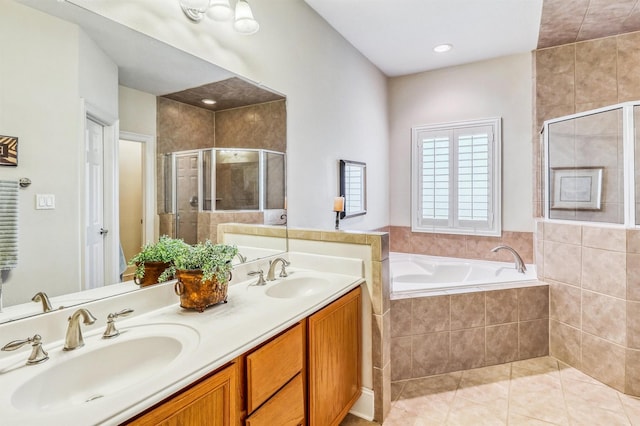 3026 Dees Cir, Sealy, TX 77474 - bathroom featuring a bath, tile patterned flooring, a stall shower, and a sink