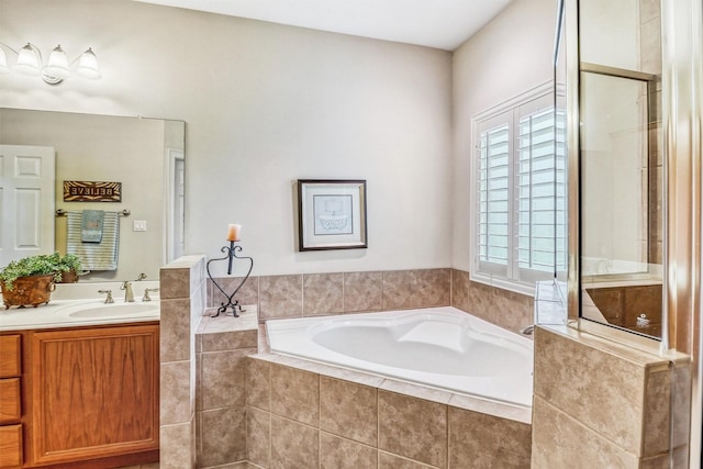 3026 Dees Cir, Sealy, TX 77474 - bathroom featuring a garden tub, a shower with door, and vanity