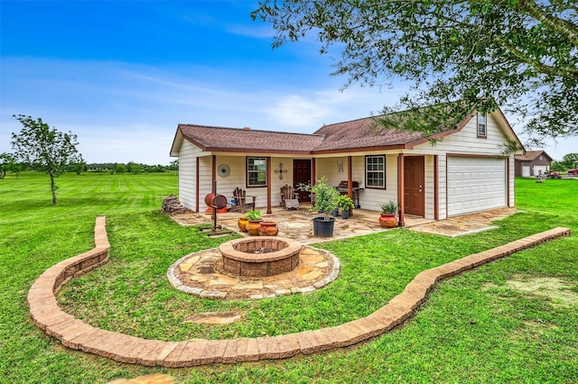 3026 Dees Cir, Sealy, TX 77474 - back of property with a yard, an outdoor fire pit, and a garage