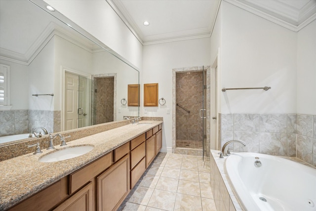 bathroom with crown molding, a bath, a sink, and a shower stall